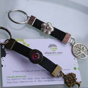 Design Schlüsselanhänger Leder Schwarz Bronze / Silber Metall Lebensbaum Floral